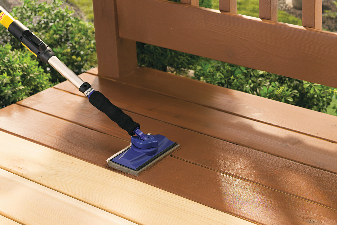 Man Cleaning Deck Prior to Staining