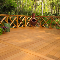Stained deck with elegant railing and chiminea. 