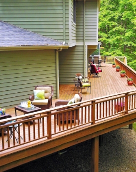 Nicely appointed wrap around deck adds comfortable living space. 