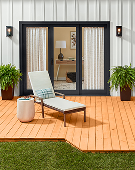 Modern low deck with chair and plant protected with Thompson’s WaterSeal Wood Protector in Transparent Natural Cedar