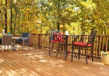 Expansive deck with multiple dining areas. 