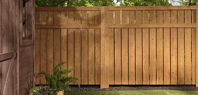 Handsome stained backyard fence.